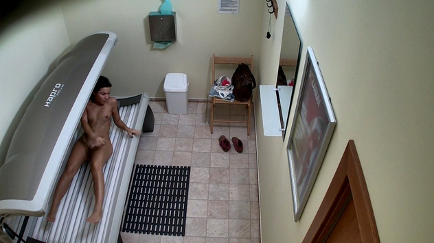 Brunette Enjoys Her Solarium Session, Flashes Her Pussy