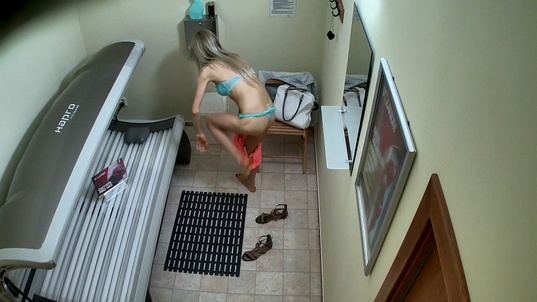 2. Download full pics of Blonde Slut Strips Again in Solarium from czechsolarium.com