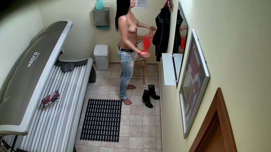 2. Download full pics of Brunette Babe Caught Stripping in Solarium from czechsolarium.com