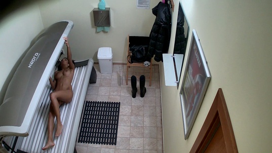 3. Download full pics of Dark-Haired Beauty Strips and Shows Everything from czechsolarium.com