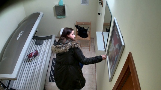 1. Download full pics of Busty Brunette Strips Down Again in Solarium from czechsolarium.com