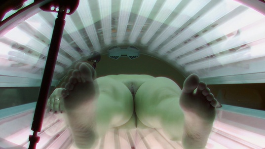 3. Download full pics of Busty Brunette Strips Down Again in Solarium from czechsolarium.com