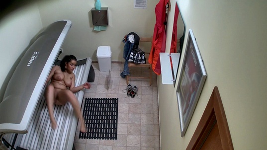 3. Download full pics of Busty Dark-Haired Girl Strips for the Cameras from czechsolarium.com