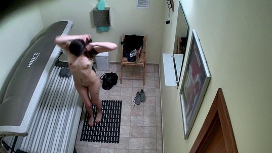 3. Download full pics of Teen Brunette Flashes Her Tight Pussy in Solarium from czechsolarium.com