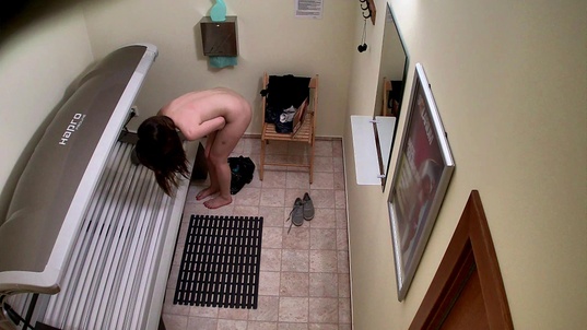 5. Download full pics of Teen Brunette Flashes Her Tight Pussy in Solarium from czechsolarium.com