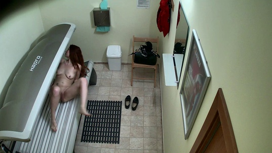 3. Download full pics of Sexy Redhead Lights Up the Solarium from czechsolarium.com