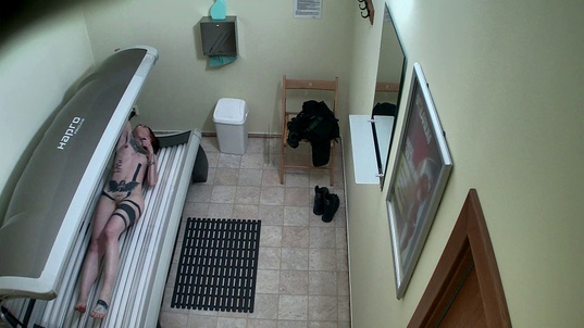 3. Download full pics of Tattooed Redhead Unwittingly Gets Filmed from czechsolarium.com