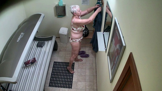 2. Download full pics of Busty Granny Exposed in the Solarium from czechsolarium.com