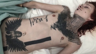 1. Download full pics of Exorcism Of A Tattooed Whore from ghost-porn.com